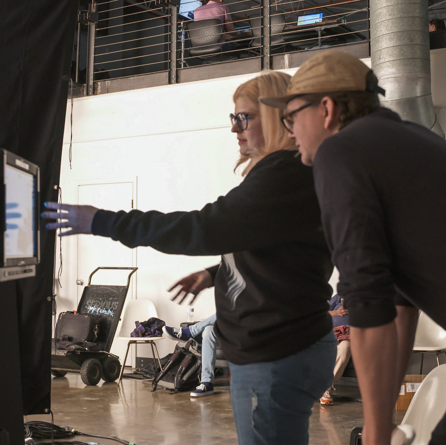Cerebral Lounge Director Owen Lang and Senior Producer Heidi Torma on set at a video shoot.